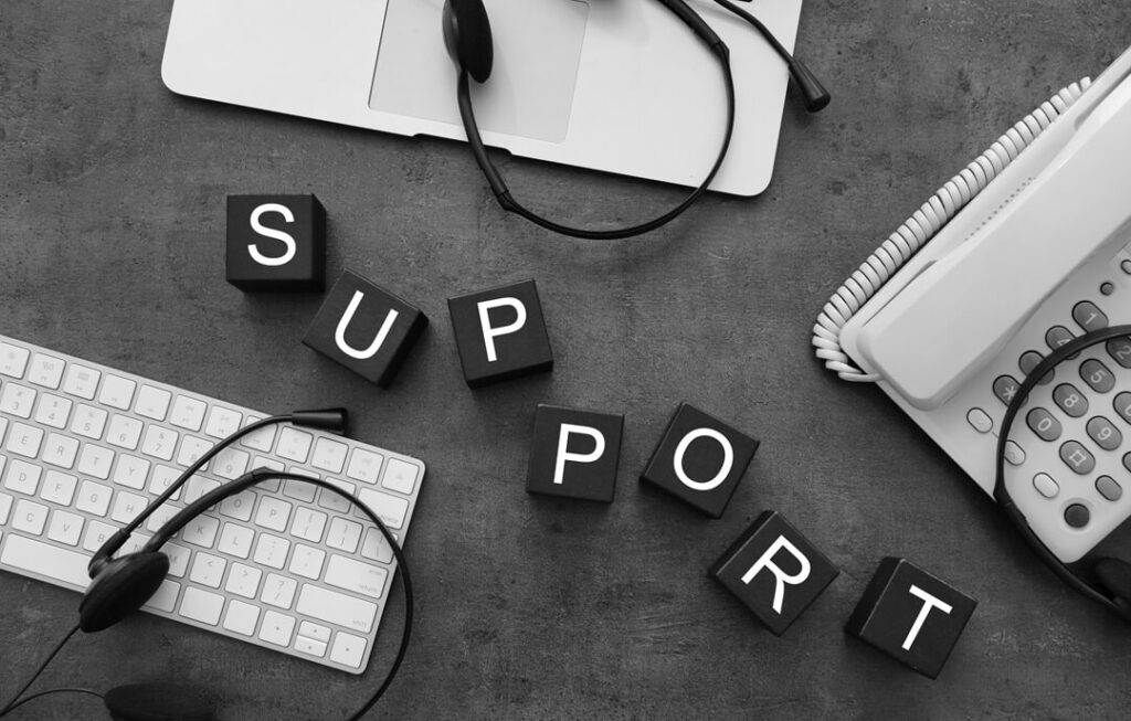 seamless workspace depicts a support system in action, featuring headsets and communication tools that emphasize connectivity and collaboration