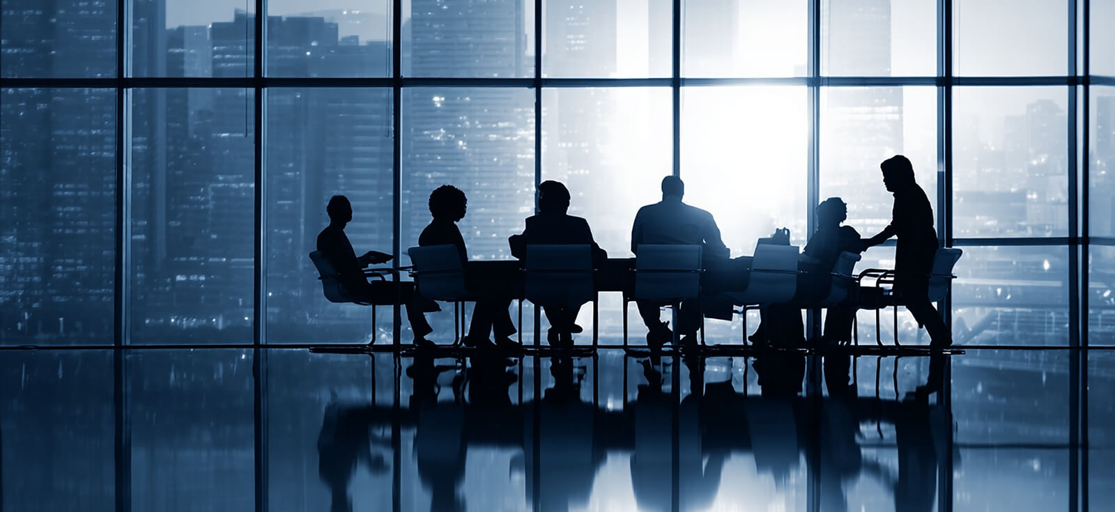 Silhouette of business people in meeting room with panoramic window