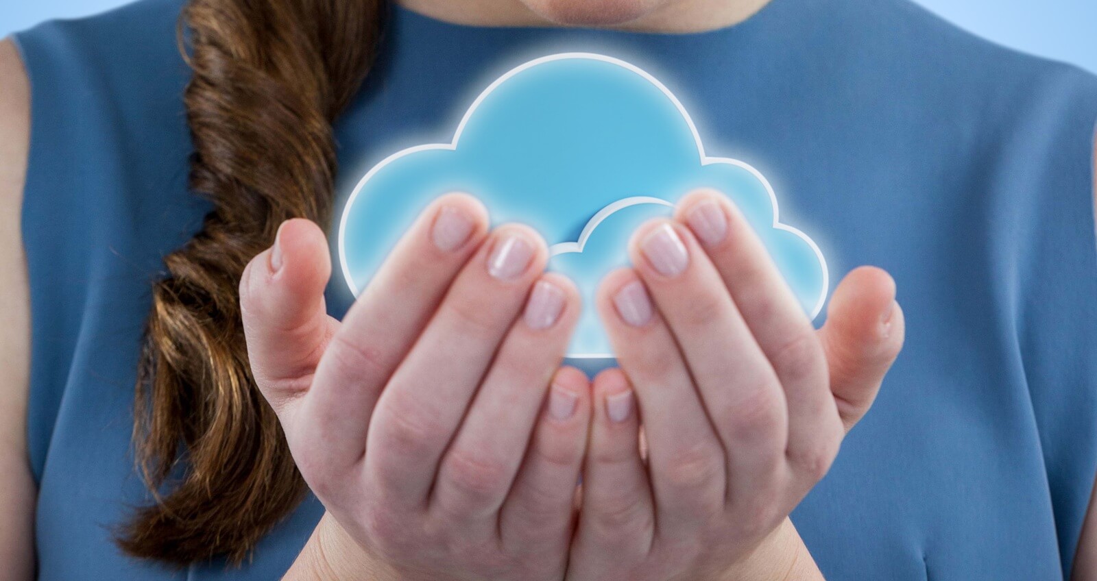 beautiful woman with hands cupped against blue background