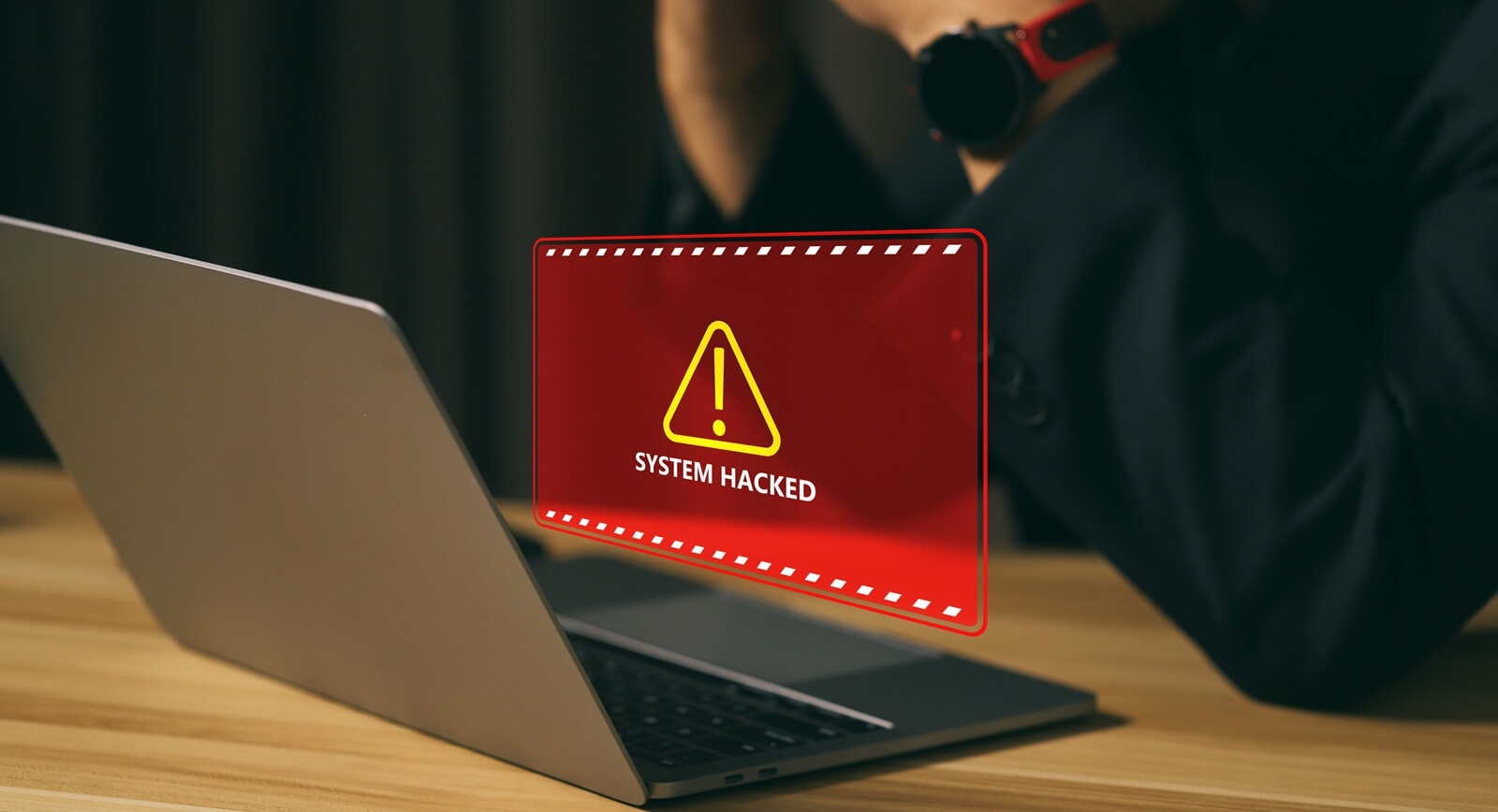 breach alert on a laptop screen showing system hacked warning message