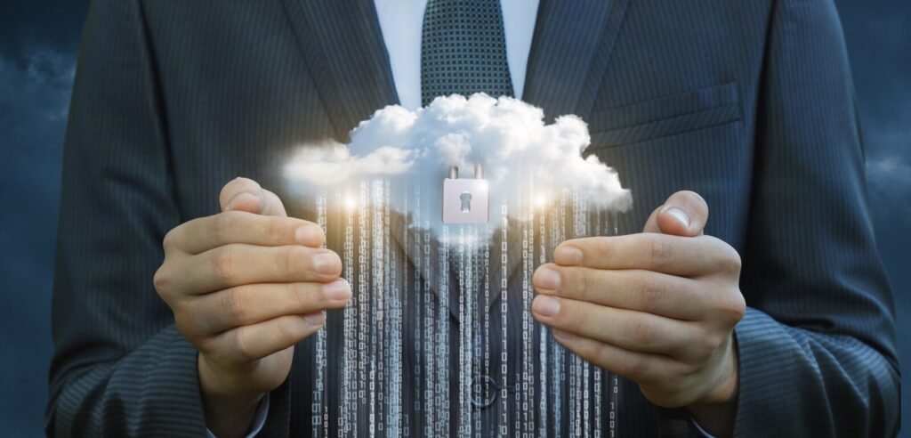business man protects the flow of information from the cloud
