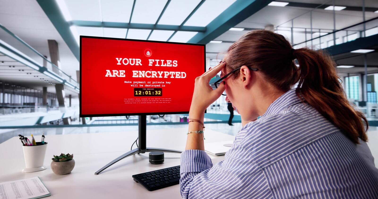 businesswoman fights cyber ransomware attack on pc computing system