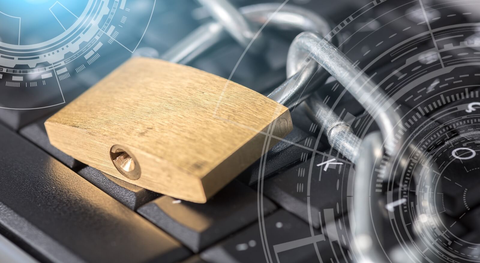 computer security concept with a padlock and a chain on a keyboard