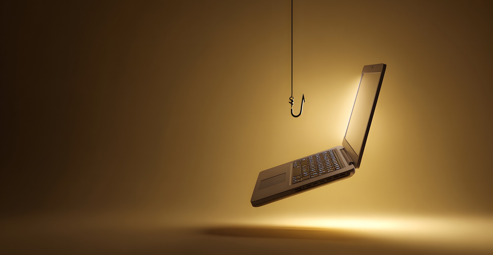 laptop hanging on a fishing hook against a golden background with sparkles