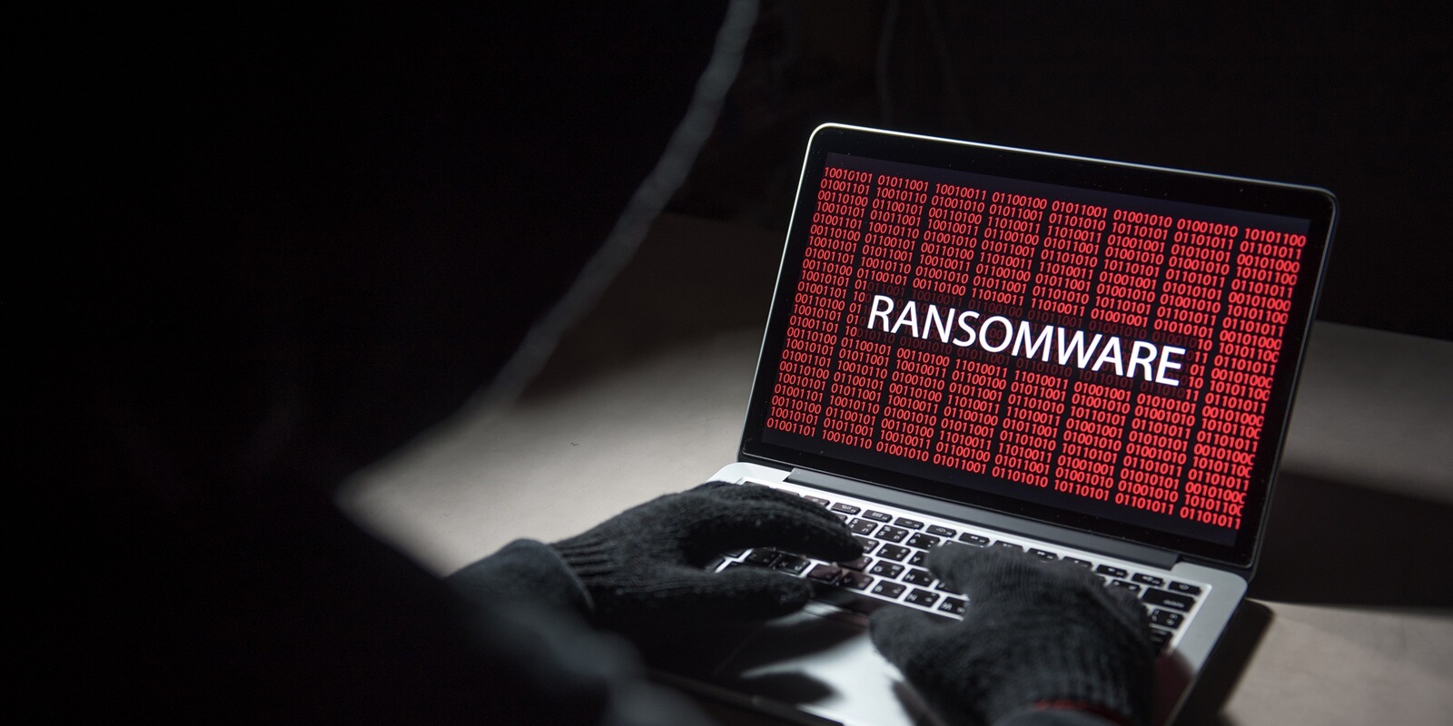 male hacker hacking into computer operating system