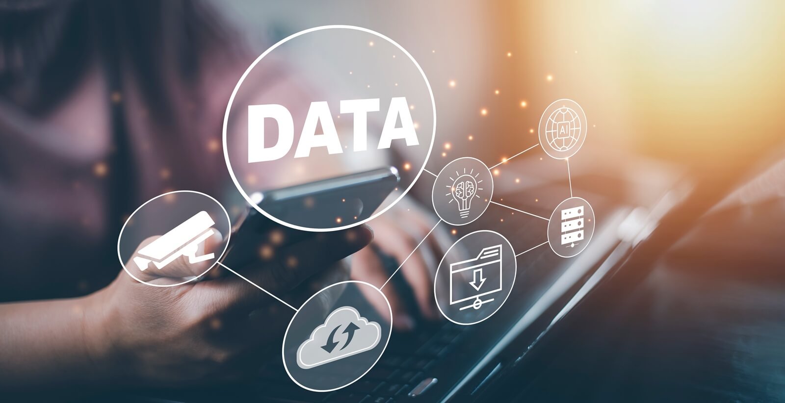 man using a laptop with Analytics and Data Management System on the computer