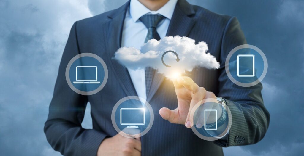 businessman clicks on a data cloud in the sky