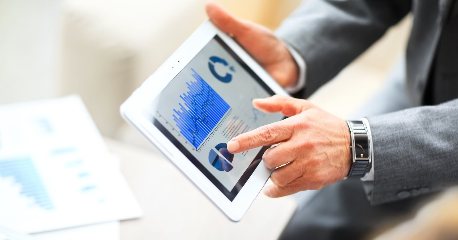 businessman works with financial timetable