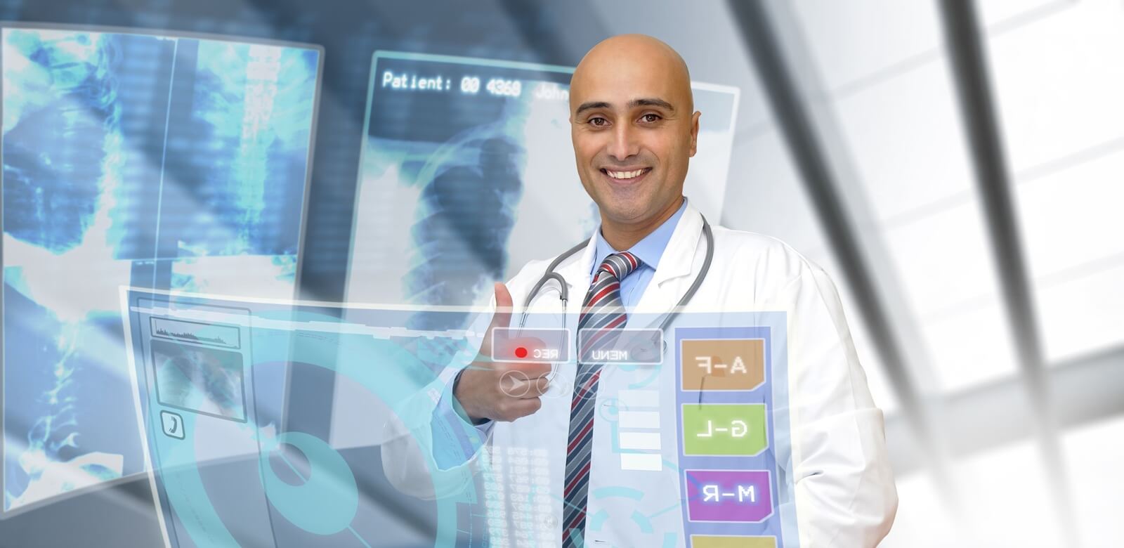doctor in uniform with X-rays and digital screens and keyboard
