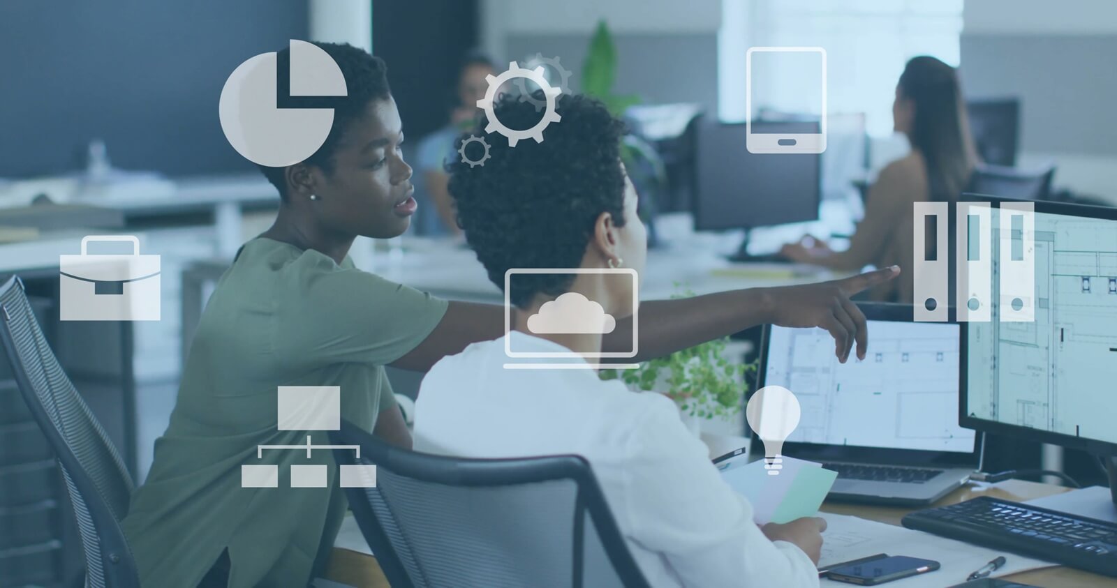 image over diverse professionals working on computers in office