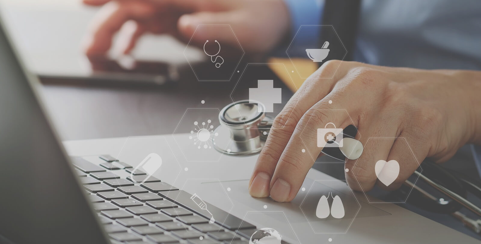 close up of smart medical doctor working with laptop computer and mobile phone and stethoscope on dark wooden desk with virtual reality icon diagram