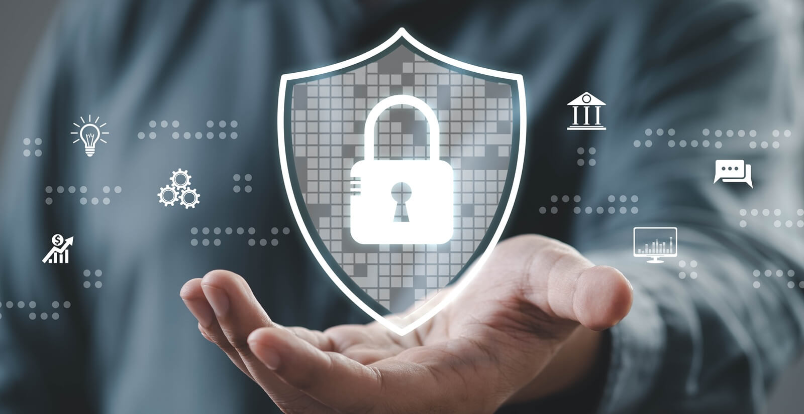 person demonstrating digital security with a hand gesture, showcasing a lock icon on a shield in a technology-focused environment