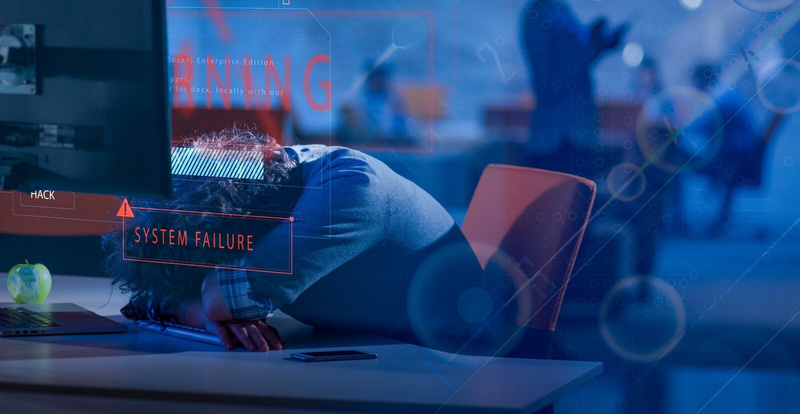 young tired casual businessman relaxing at the desk in his night office