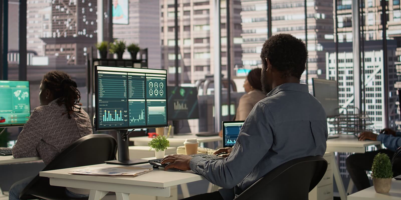 executive analyst finalizes a financial report and reviews data, developing a forecast for organizational progress