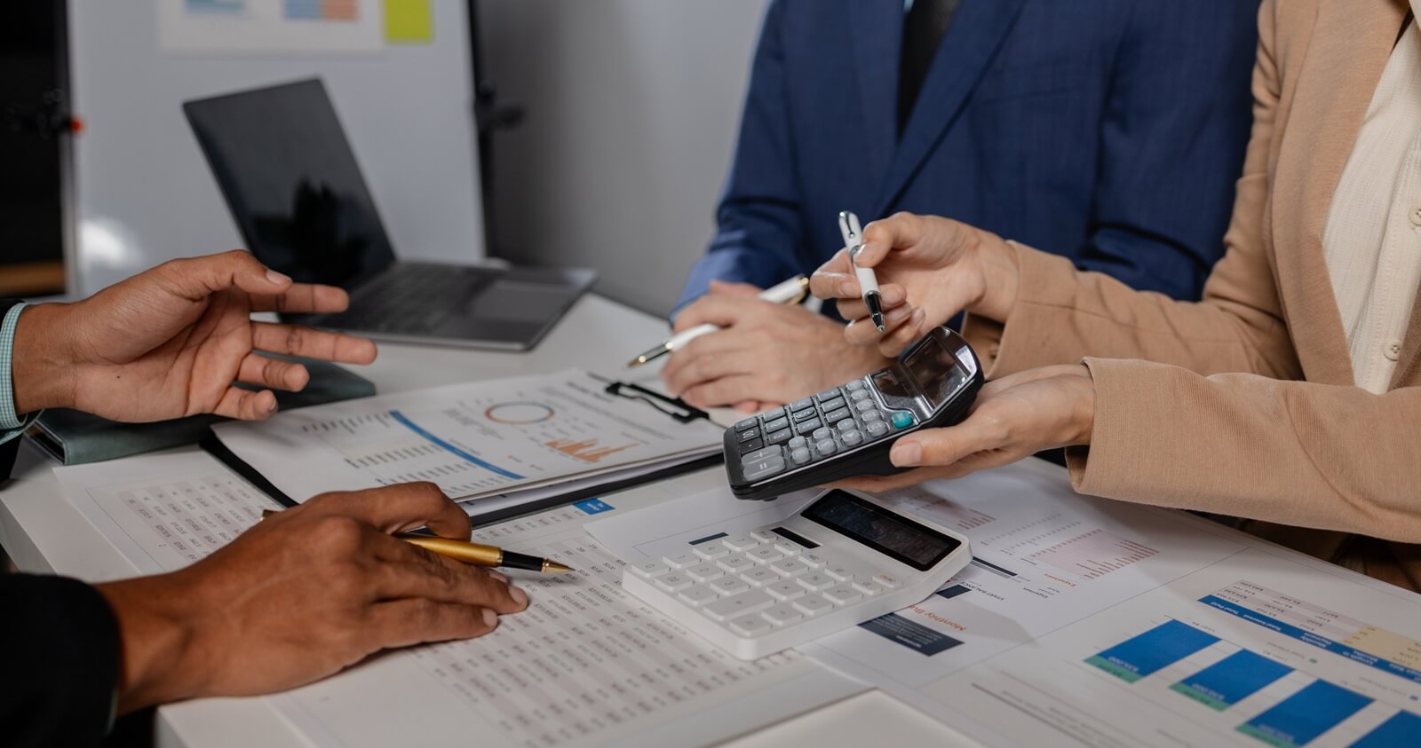 group of business people are discussing company figures to resolve quarter of the year's losses