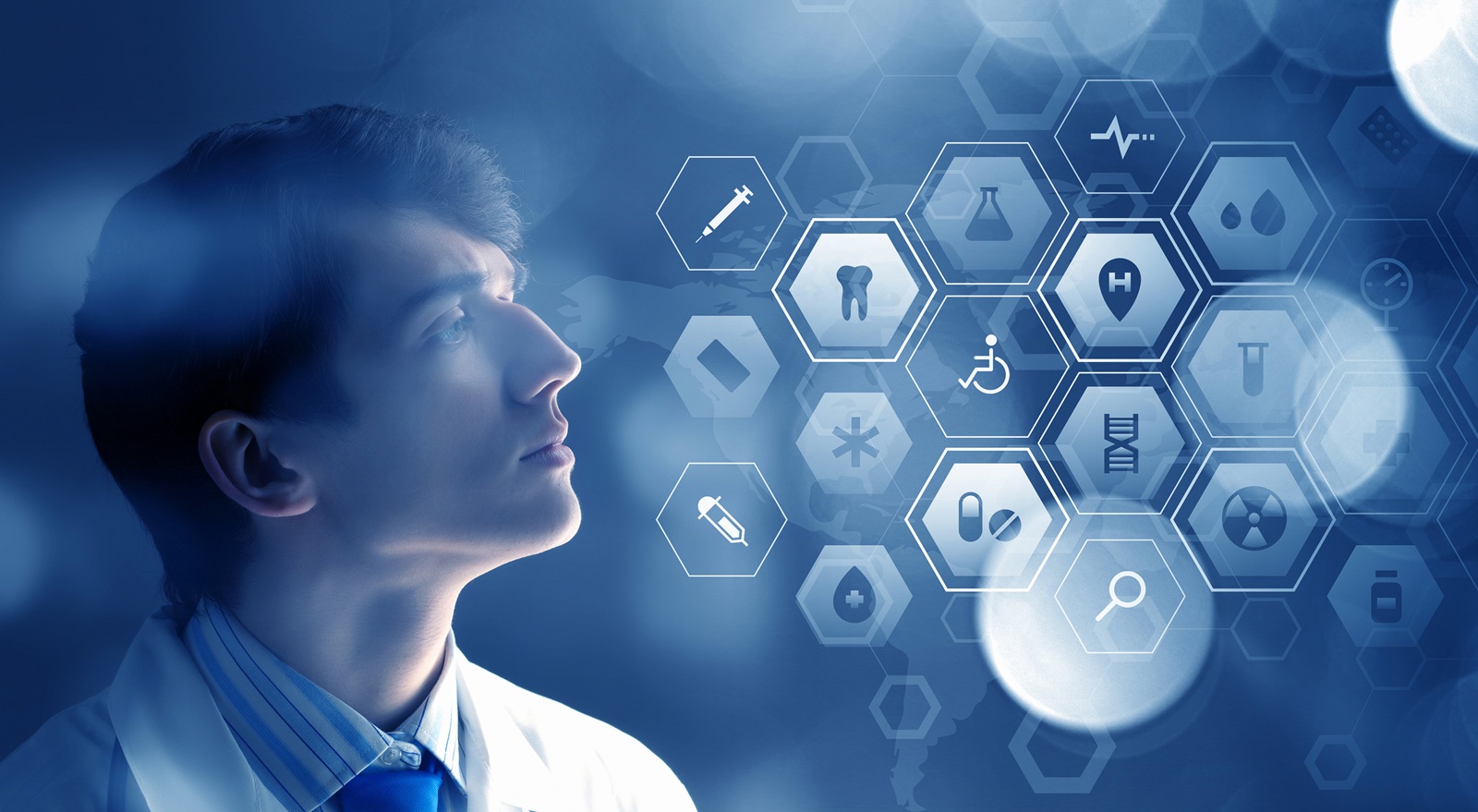 male pensive medical doctor looking at healthcare icons