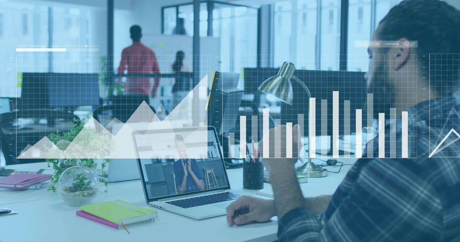 man in plaid shirt analyzing laptop call in office, with overlayed data charts, copy space