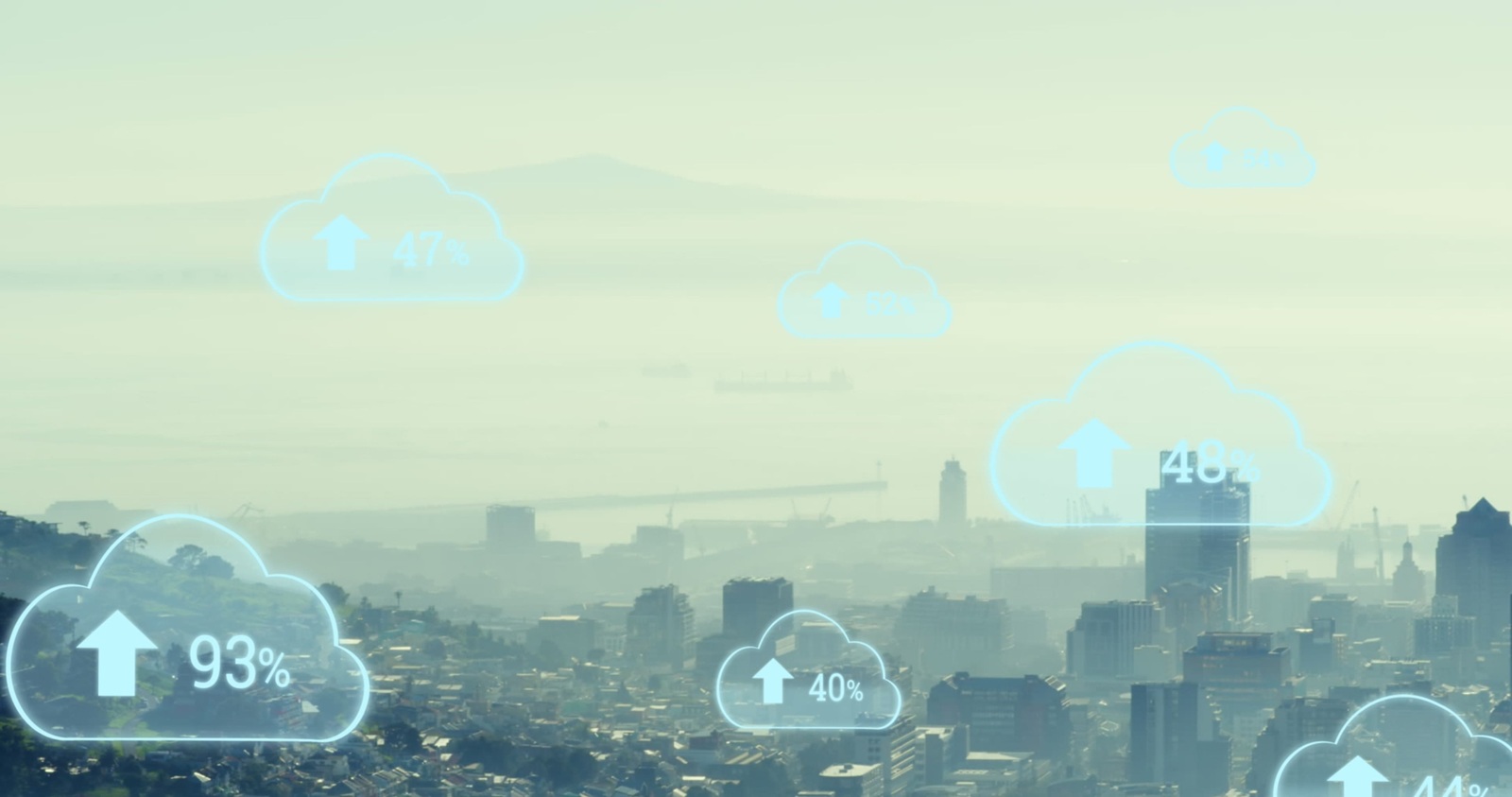 multiple cloud icons with increasing percentage against aerial view of cityscape