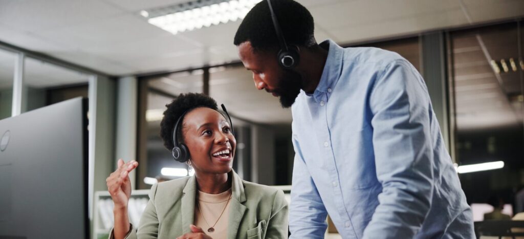 team and African people training with mentor for customer service, sales or crm at night