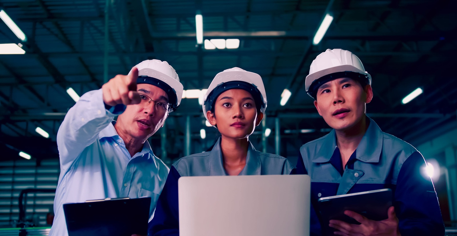 team of engineers is explaining remote machine control to industrial owners