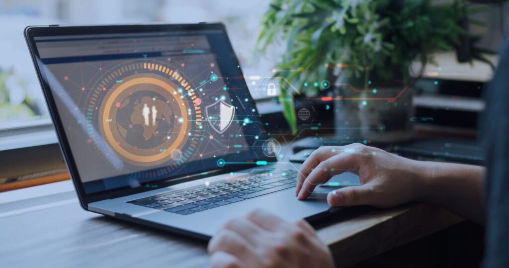 laptop with futuristic digital interface displaying data security icons, representing online protection