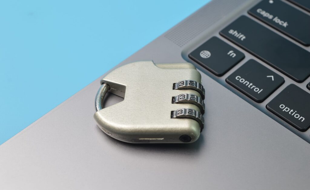 steel padlock and computer keyboard