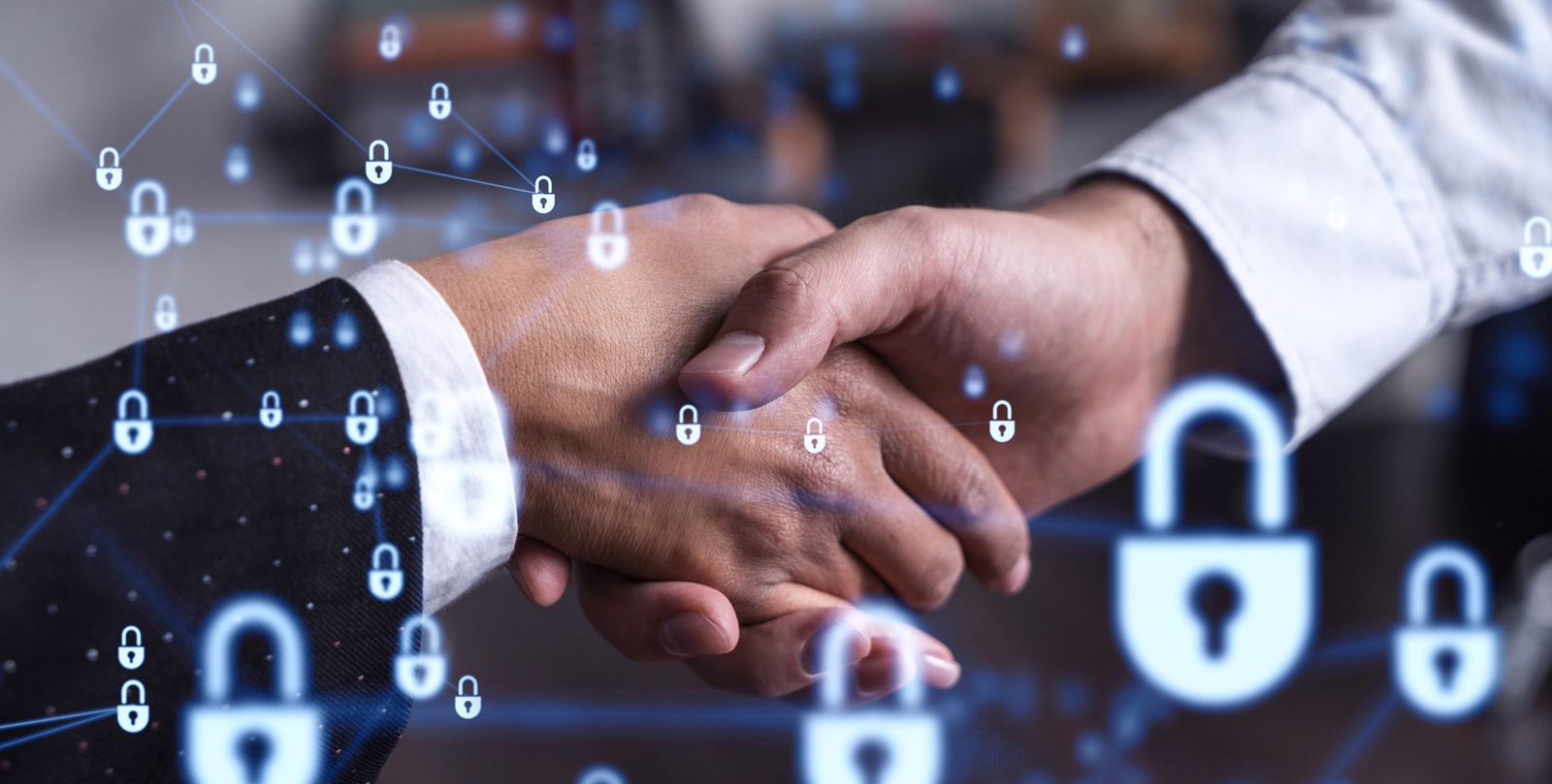 Handshake of two businesspeople who are negotiated the project to protect cyber security of international company