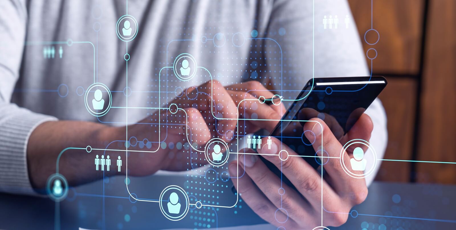 hr specialist browsing social networks in the Internet in smart phone to find the best candidates to hire international team