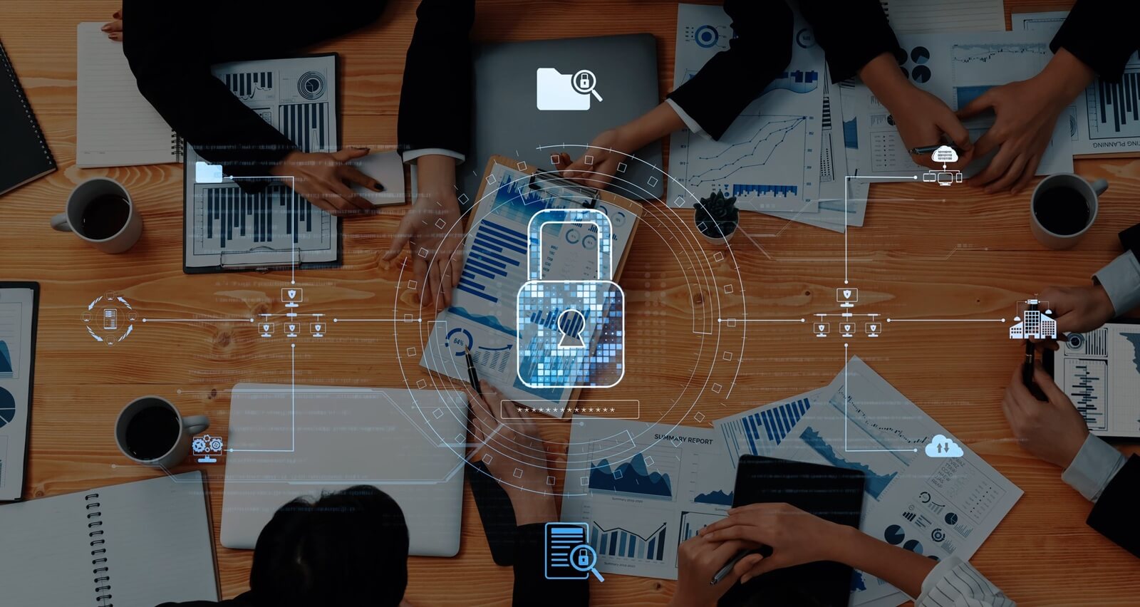 business meeting centered on data security features professionals analyzing charts on various devices
