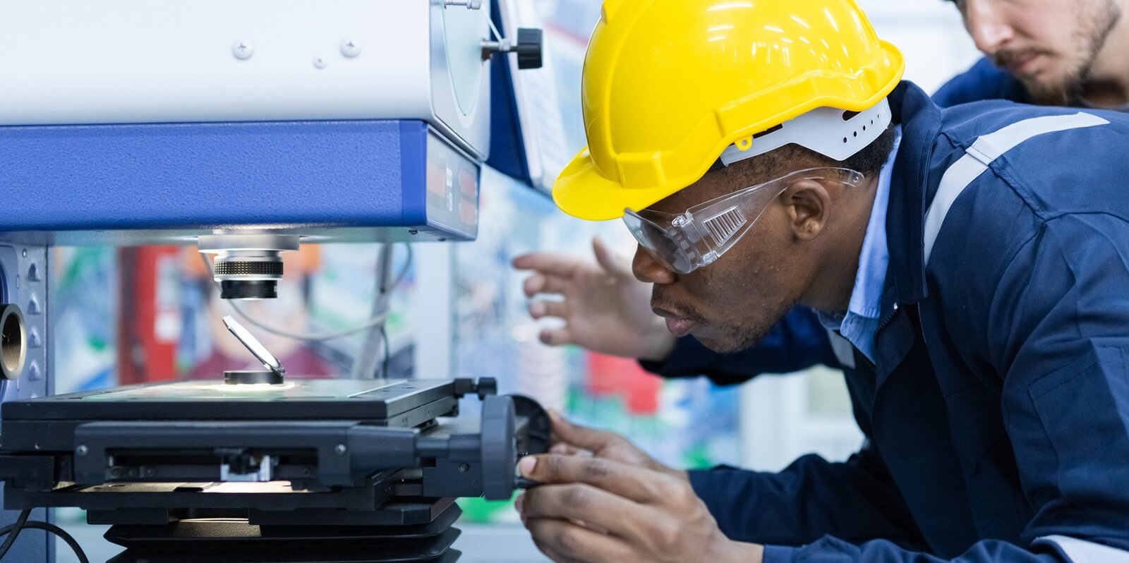male African American engineer workers in manufacturing factory workplace