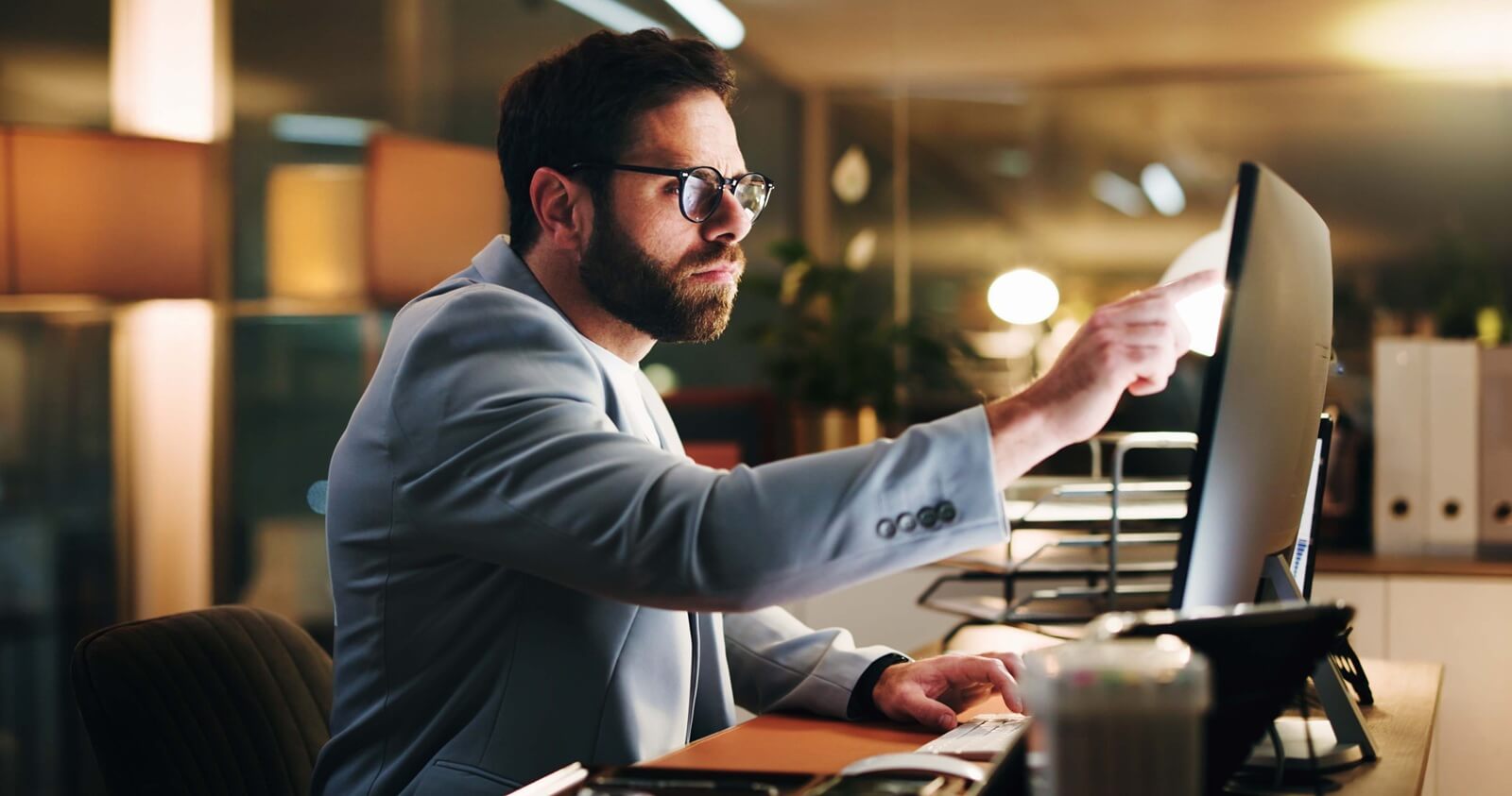 pointing and research with business man in office for trading analyst, planning and night