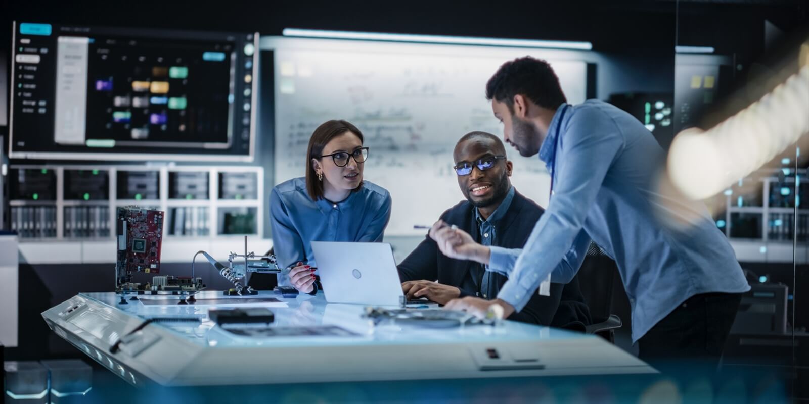 diverse team of engineers collaborating on manufacturing project in a research facility