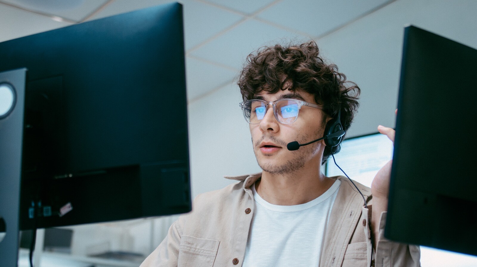 male expert IT technician support agent working with computer