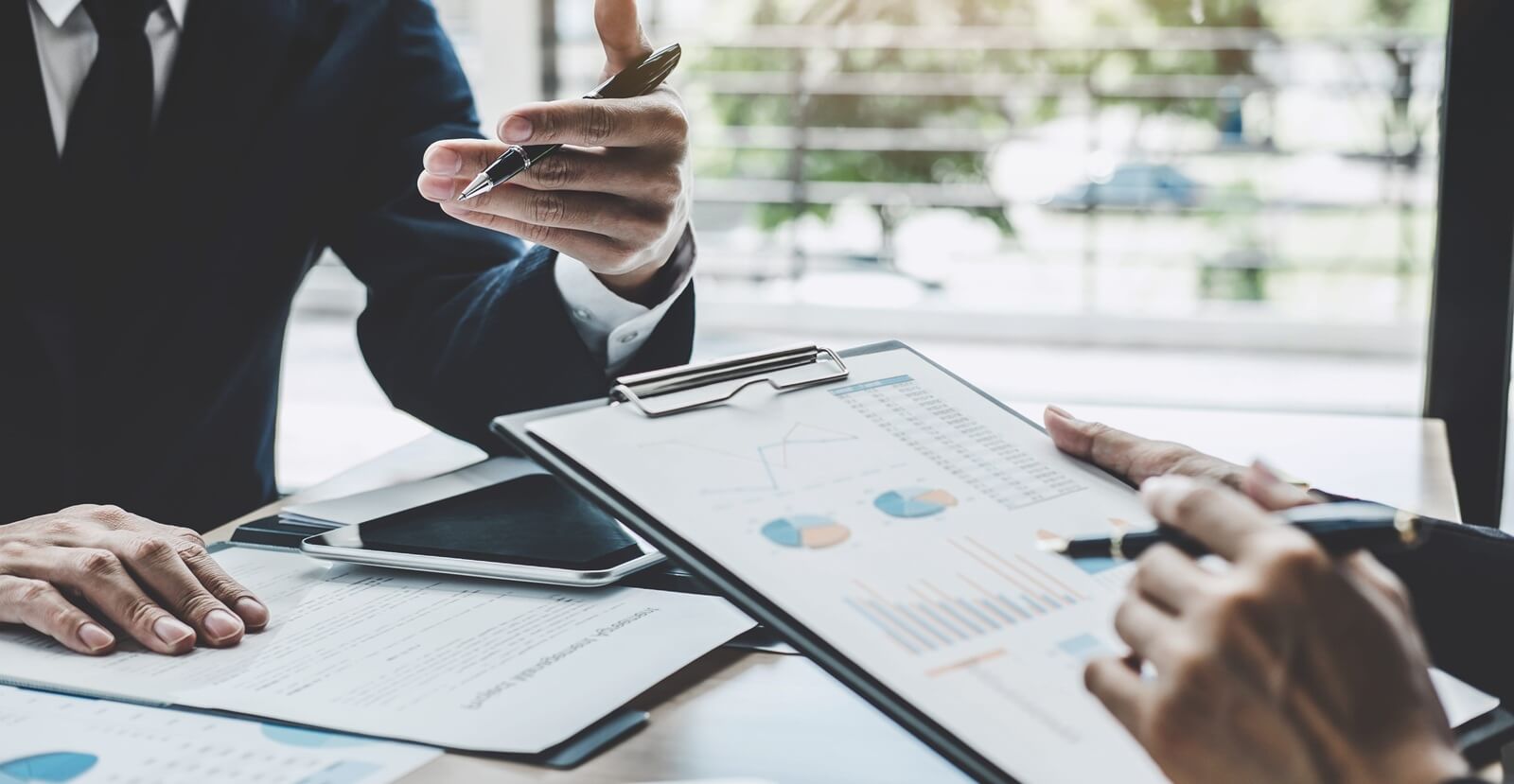 executive discussing company growth project success financial statistics
