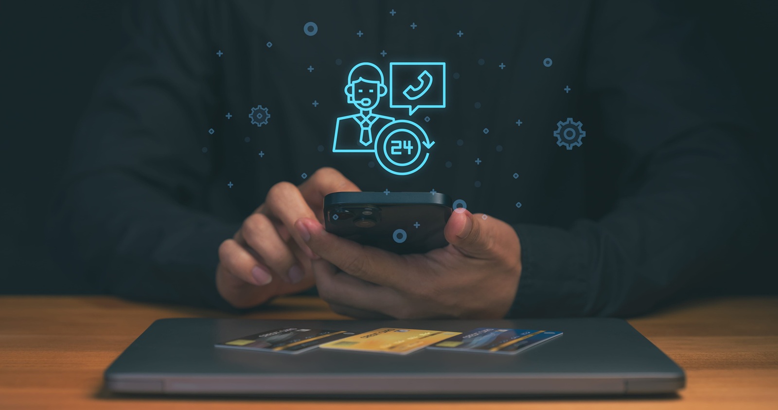 hand using smartphone with virtual customer support icons, 24 hour service symbol, and call center assistant, online banking