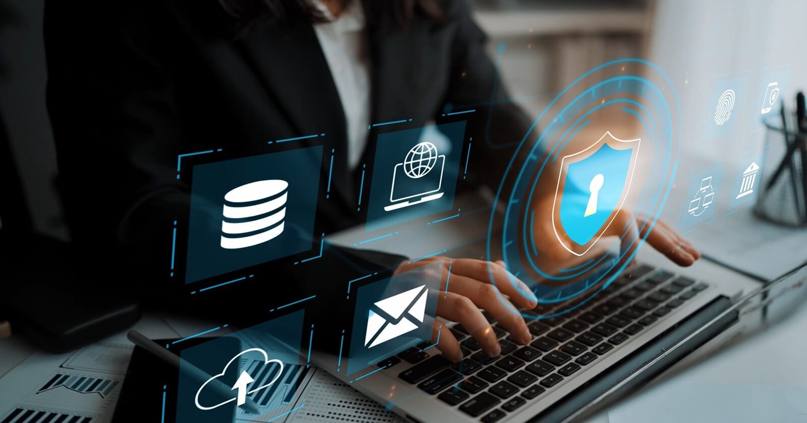 modern businesswoman using laptop with cybersecurity icons