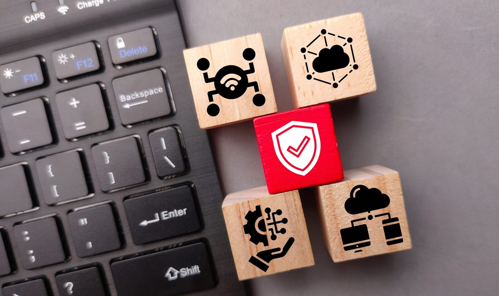 wireless keyboard and wooden block with the Key Concepts of the Internet of Things