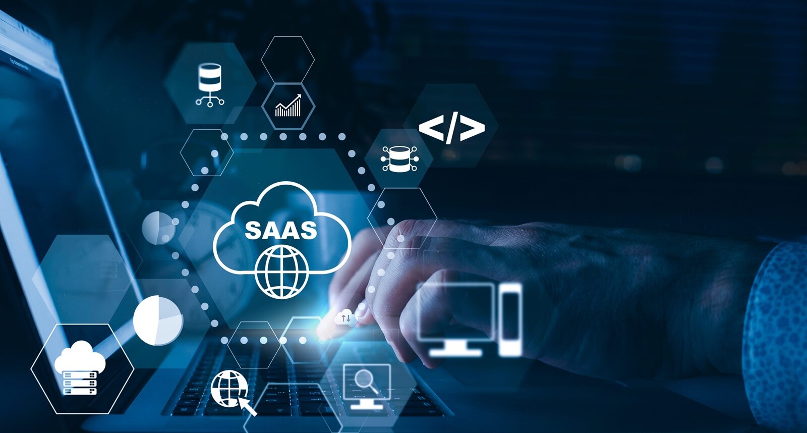 working on saas applications using a laptop at night with cloud icons on the screen